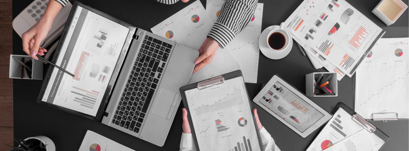 Financial documents and laptops workspace